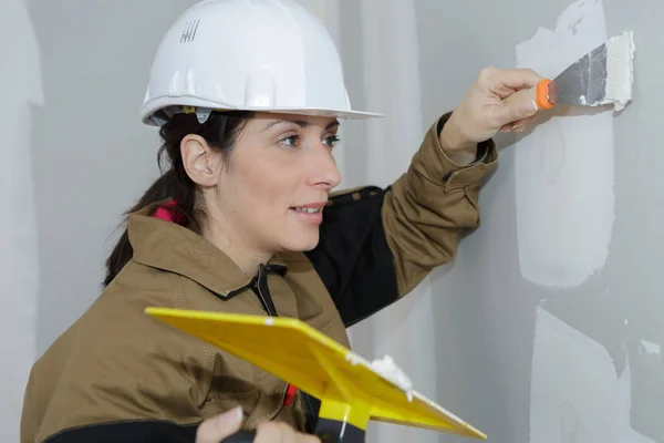 Woman plastering wall and female — Stock Photo, Image