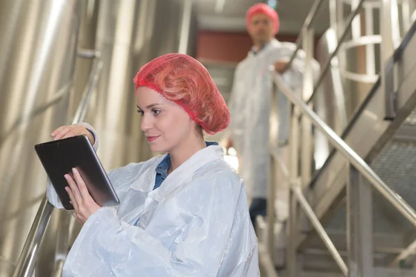 Workers on factory and checking — Stock Photo, Image