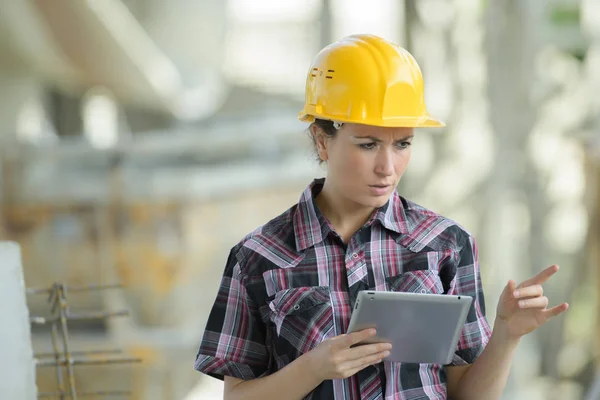 Positive female worker in hardware store — Stock Photo, Image