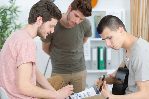 Young men composing music at home — Stock Photo, Image