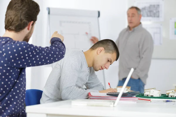 Science teacher standing in front of whiteboard — Stock Photo, Image