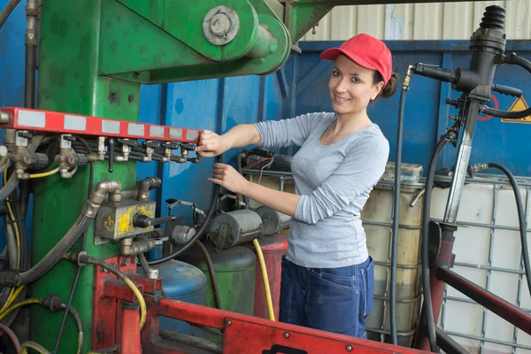 Young sexy brunette woman working as industrial mechanic — Stock Photo, Image