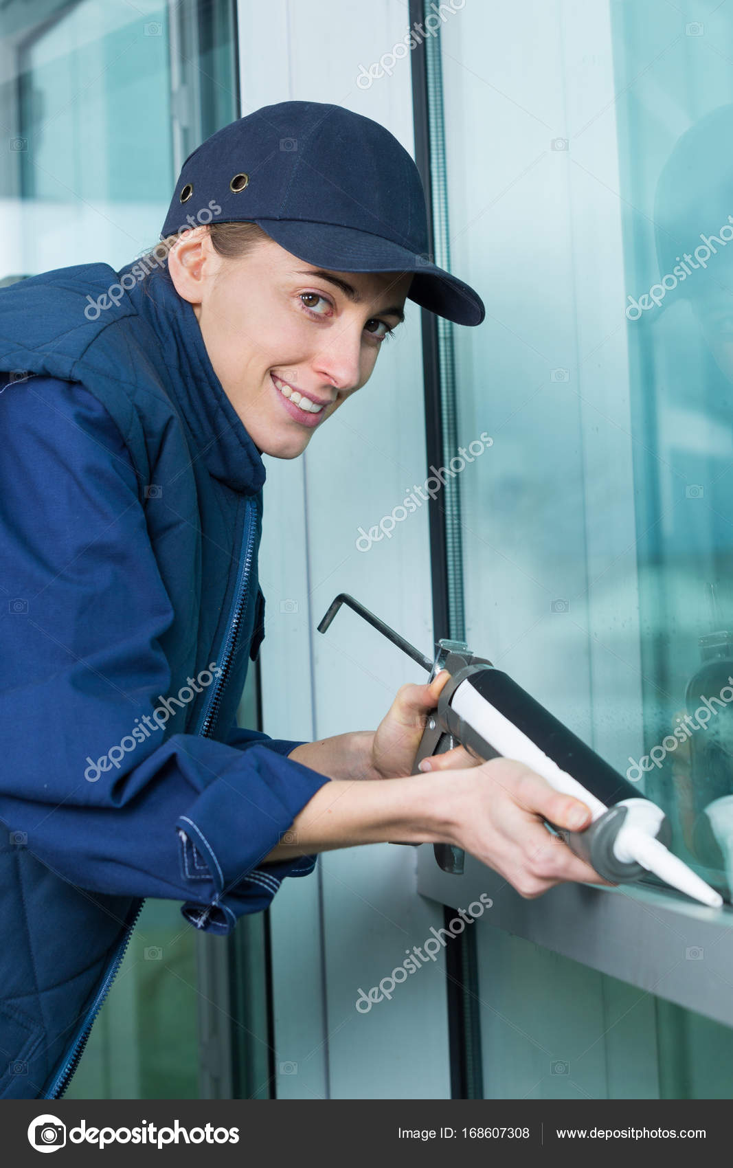 Man caulking outside window — Stock Photo © photography33 168607308