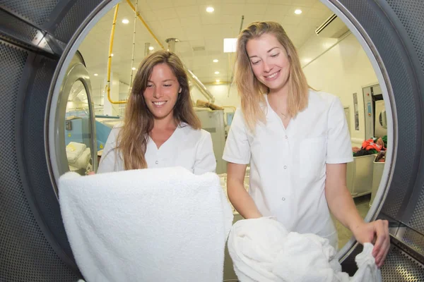 Women view from washing machine inside — Stock Photo, Image