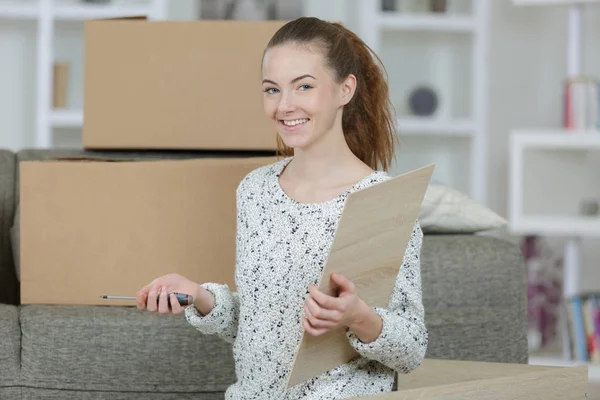 Happy female moving house — Stock Photo, Image