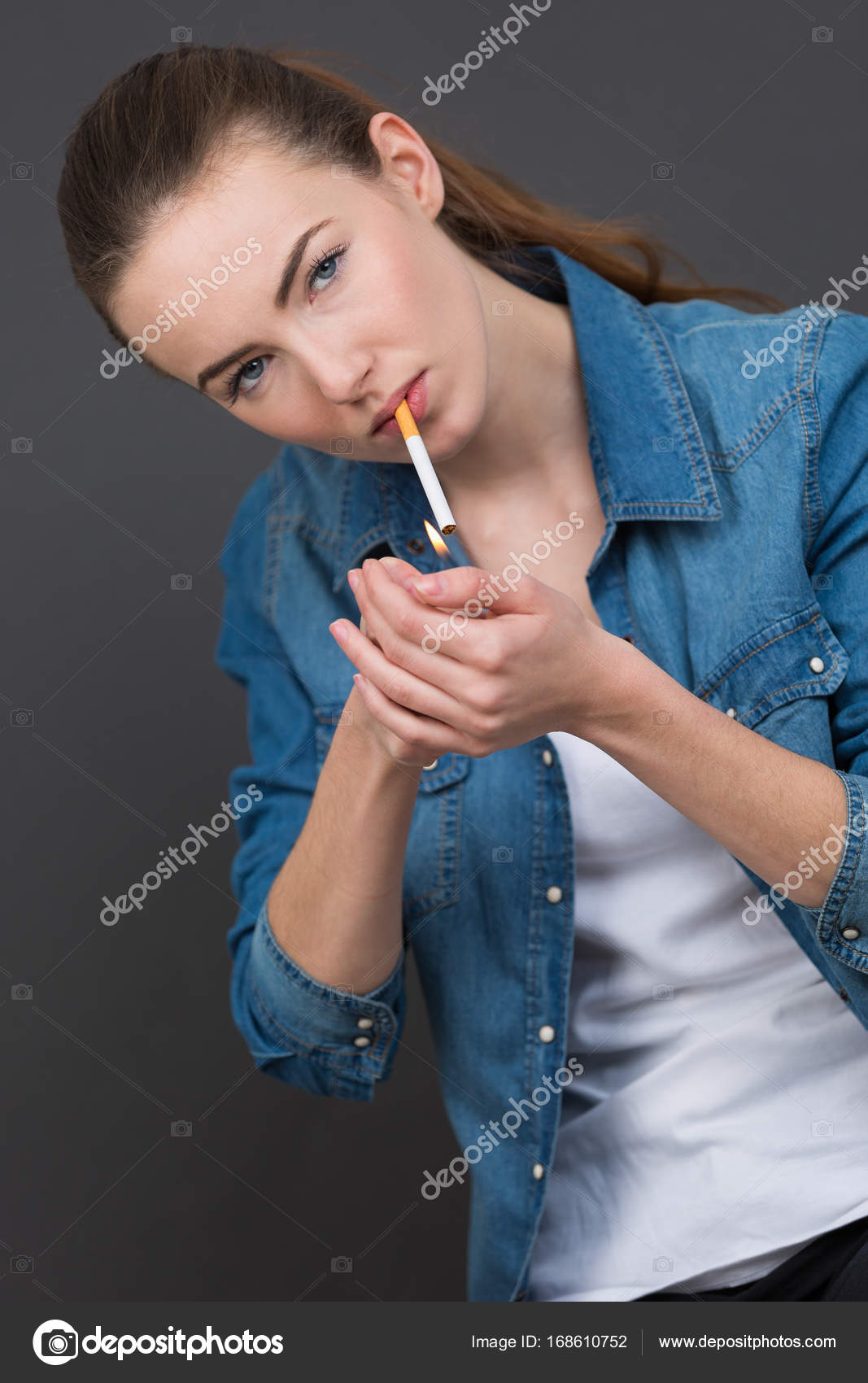 Beautiful woman lighting cigarette unhealthy lifestyle concept Stock Photo  by ©photography33 168610752