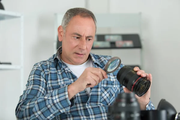 Photographer checking problem on his camera — Stock Photo, Image