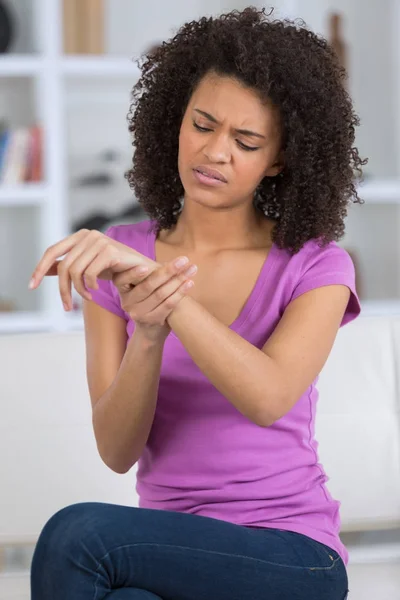 Girl with pain in the wrist — Stock Photo, Image