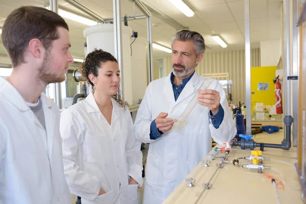 Apprentices and teacher during class — Stock Photo, Image