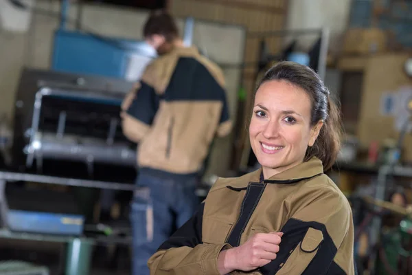 Young girl worker in the factory — Stock Photo, Image