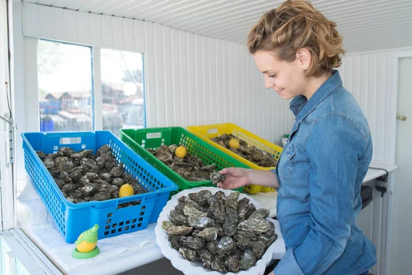 Young blonde oyster worker — Stock Photo, Image