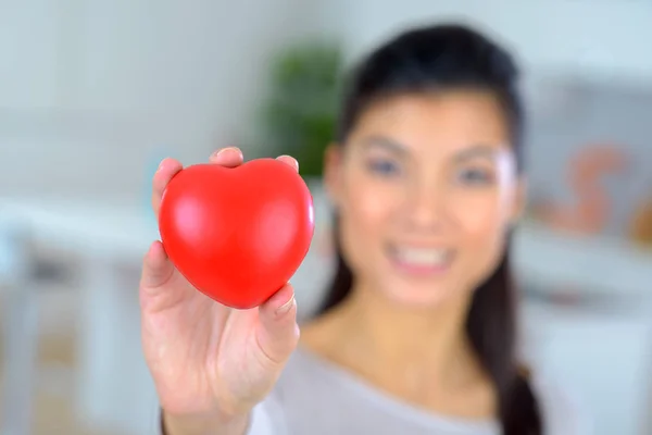 Beautiful woman showing heart — Stock Photo, Image