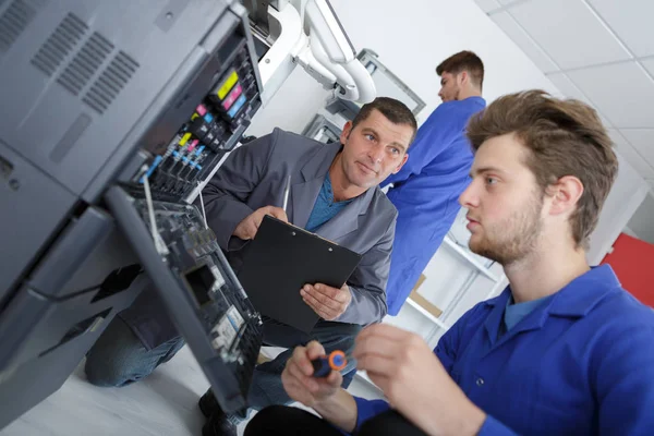 Repairing a printer and male — Stock Photo, Image
