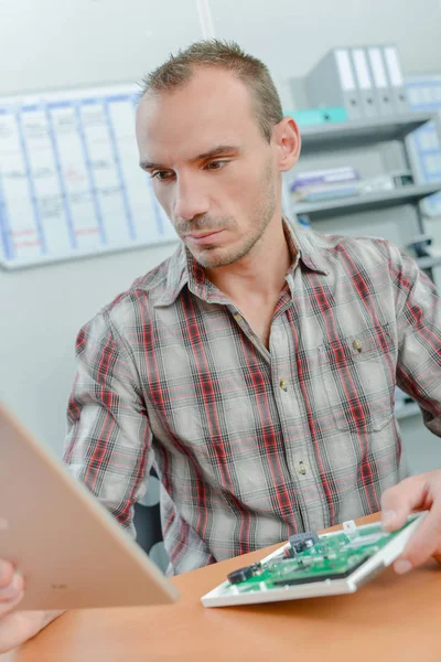 Working technician and adult — Stock Photo, Image