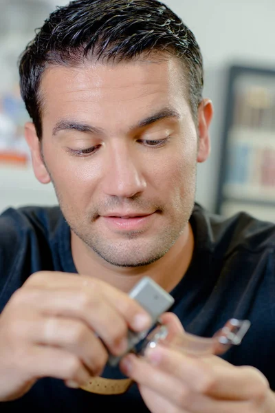 Clockmaker repairing wrist watch — Stock Photo, Image