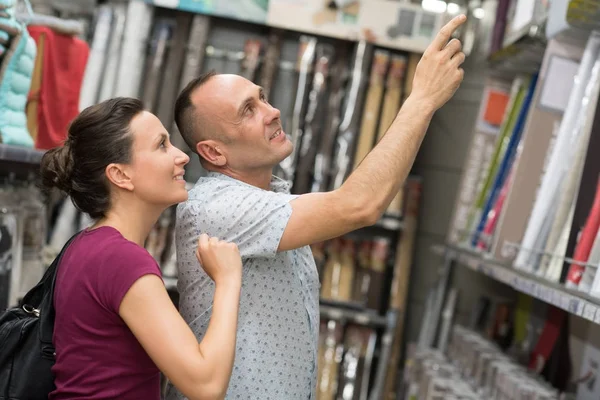 Loving couple in the library — Stock Photo, Image