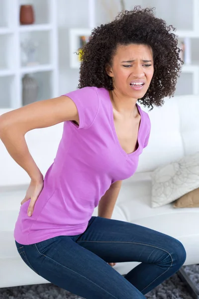 Woman with severe lower back pain — Stock Photo, Image
