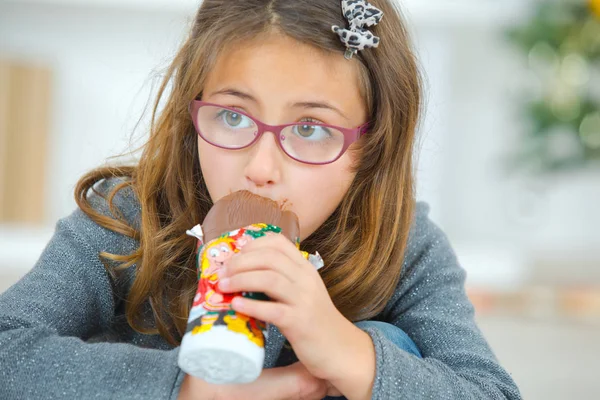 Greedy little girl eating chocolate — Stock Photo, Image