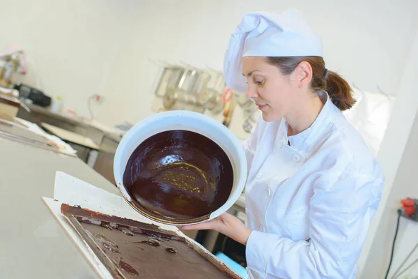 Chef transferring the mixture — Stock Photo, Image