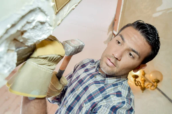 Chiselling off plaster and adult — Stock Photo, Image