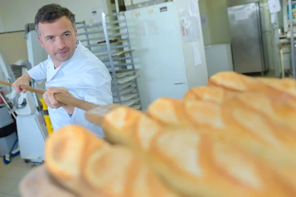 Freshly baked bread and work — Stock Photo, Image