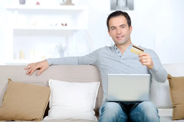 Man showing his bank card — Stock Photo, Image