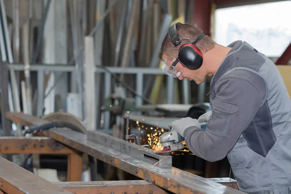 Man angle grinding metal — Stock Photo, Image