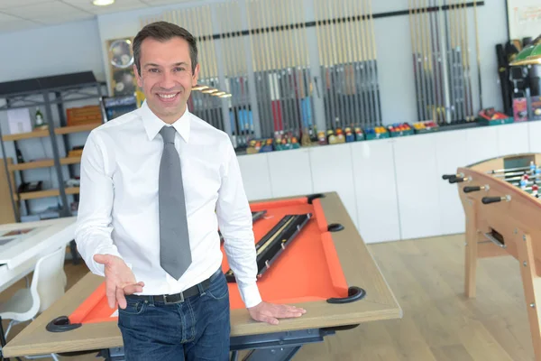 Businessman next to football table in an office — Stock Photo, Image