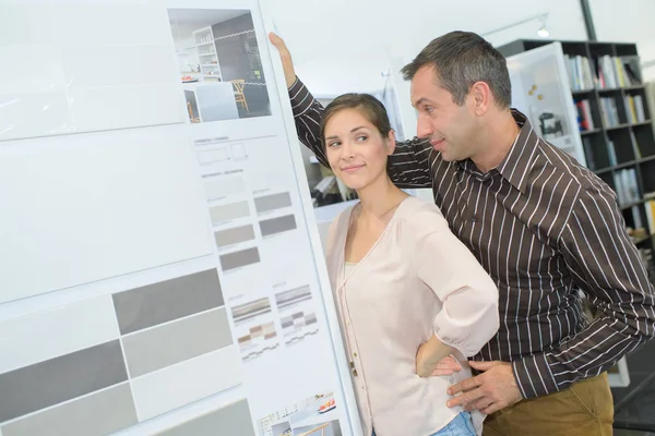 Couple in furniture store — Stock Photo, Image