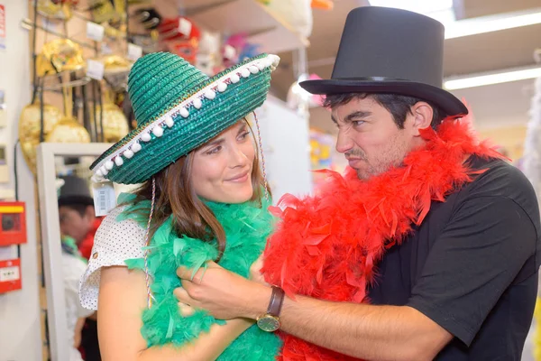 Couple pulling faces in fancy dress costumes — Stock Photo, Image