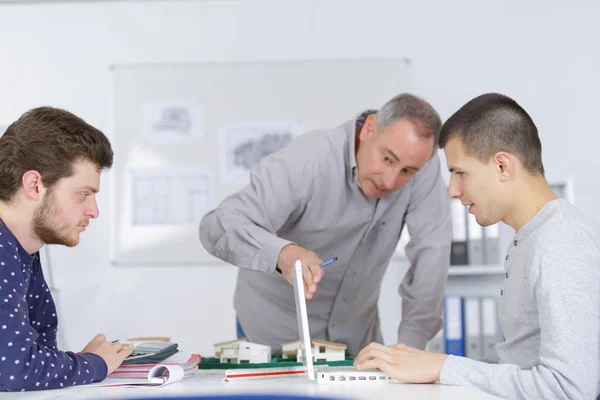 Teacher and students in a class — Stock Photo, Image