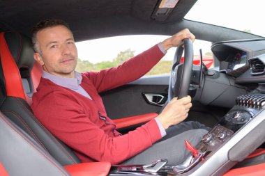 man driving a red car clipart