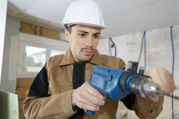 Builder worker with r drill perforator equipment — Stock Photo, Image
