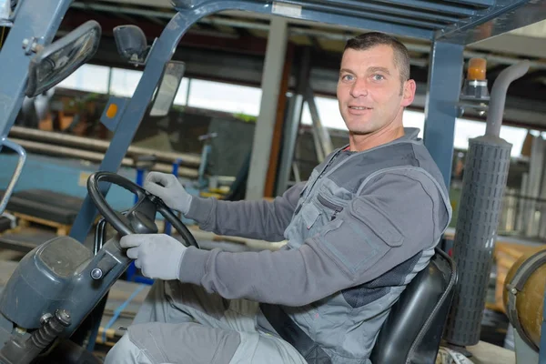 Man driving a forklift — Stock Photo, Image
