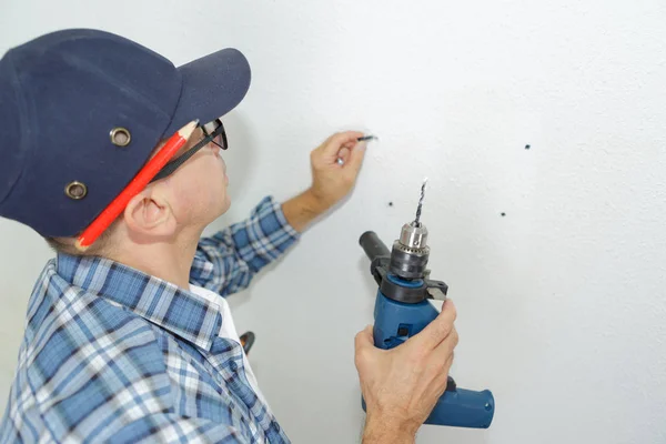 Man holding a drill — Stock Photo, Image