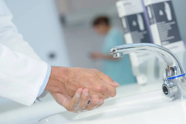 Close up of doctor washing his hands — Stock Photo, Image