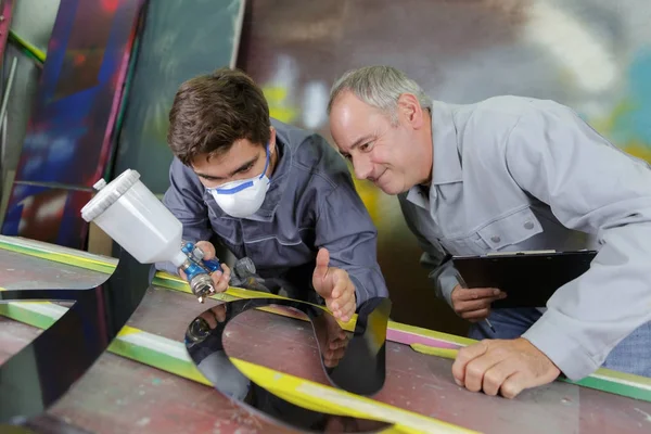 Two professional factory painters workers painting metal — Stock Photo, Image