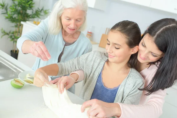 Three generations cooking and generation — Stock Photo, Image