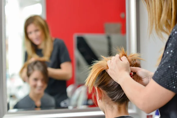 Lady having hair put up in hairdressers — Stock Photo, Image