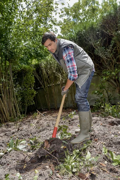 Escavação e botas de quintal — Fotografia de Stock