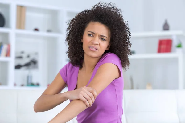 Yoing beautiful woman feeling pain in her elbow — Stock Photo, Image
