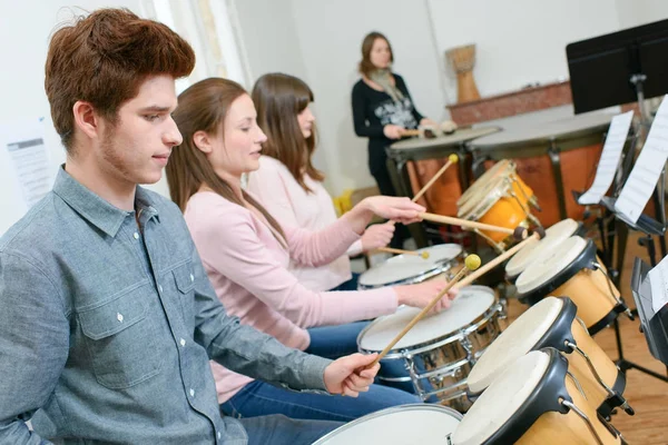 Group of students playing in school orchestra together — Stock Photo, Image