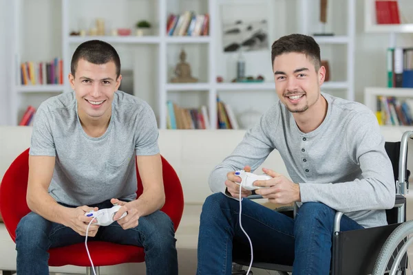Men playing video games focus on joystick — Stock Photo, Image
