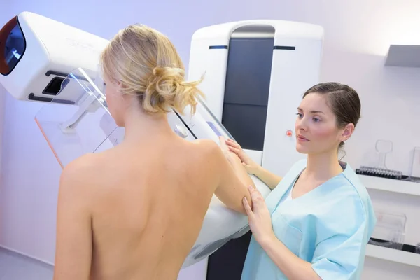 Rear view of woman having mammogram — Stock Photo, Image