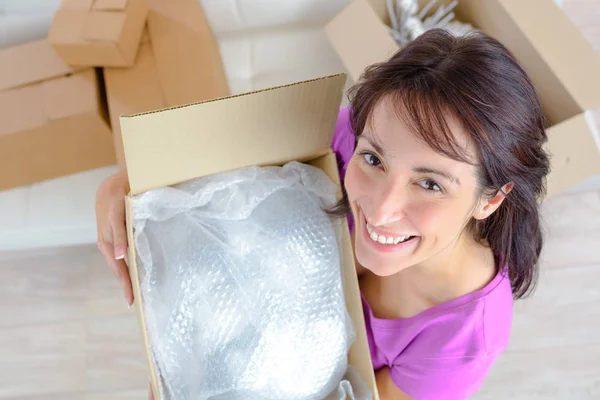 Cheerful woman moving in new apartment — Stock Photo, Image