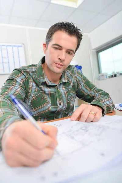 Architect drawin on his plans — Stock Photo, Image