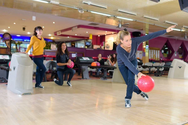 woman playing bowling and recreation