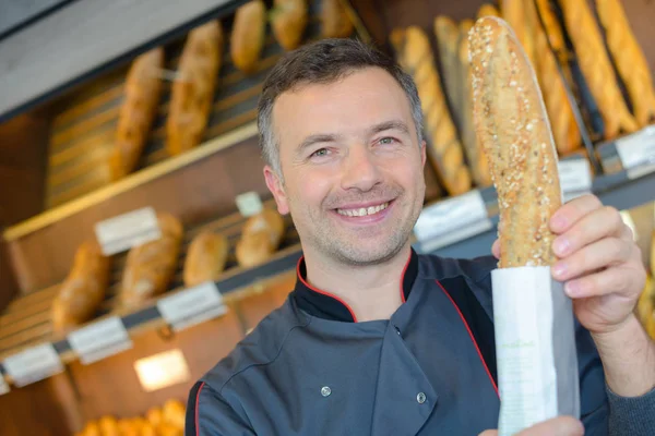 Baguete de grão inteiro e trabalho — Fotografia de Stock