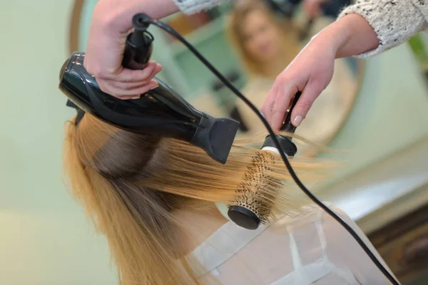 Professional hairdresser drying hair — Stock Photo, Image