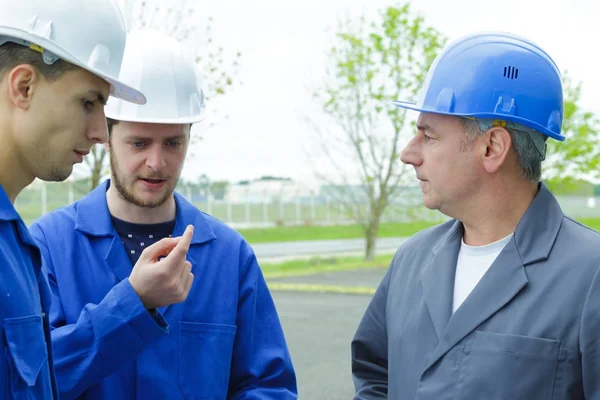 Apprentices with hard hats — Stock Photo, Image